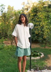 A Model Wearing White Organic Cotton Wild Ocean Heart organic cotton shirt, curated by Only Ethikal